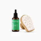 Zenvia rosemary mint hair strengthening oil bottle and scalp massager on a white background